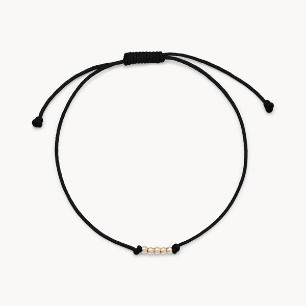 the abacus contemplation cord bracelet - 10k yellow gold, black cord