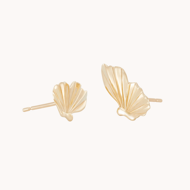 A pair of Metamorphosis Butterfly Wing Earrings in 14k yellow gold designed by Bluboho, with delicate, open shapes resembling butterfly wings. The earrings are crafted with fine lines and a polished finish, giving them a modern and elegant appearance. The plain white background highlights the intricate details.