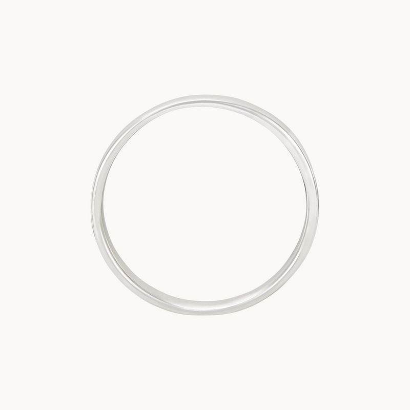 A simple sterling silver Legacy Ring by bluboho is displayed against a plain white background. The ring features a smooth, circular design that is minimalist with no additional embellishments or designs.