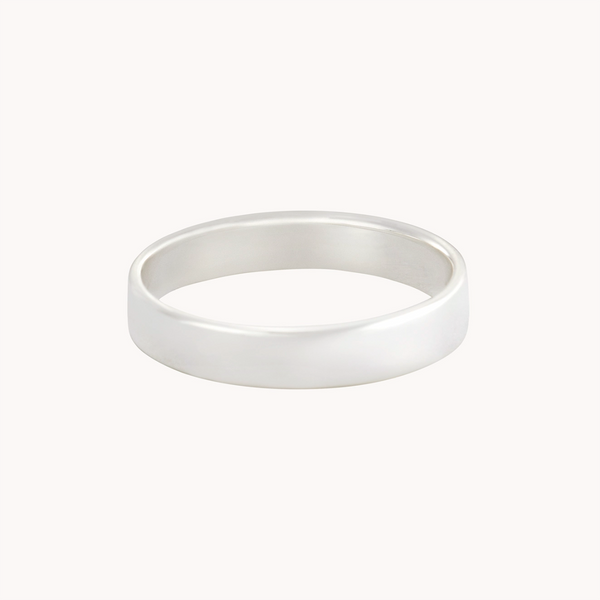 A simple, polished sterling silver ring from bluboho's Legacy Ring Silver collection features a smooth surface and slightly rounded exterior with a flat interior, elegantly showcased against a plain white background.