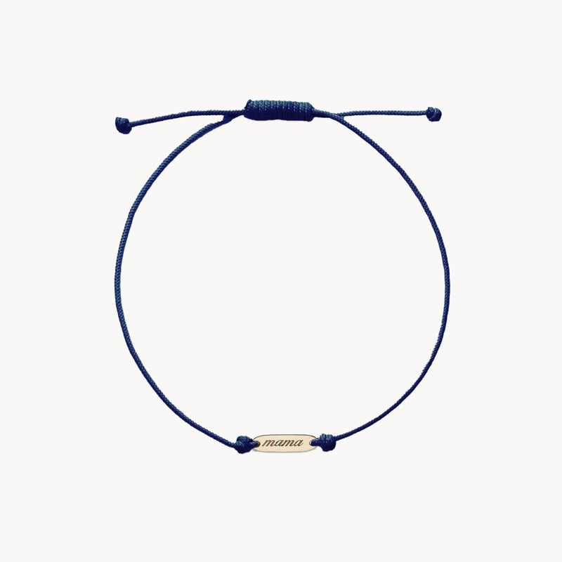 Introducing "the mother contemplation blue cord bracelet" by bluboho: a minimalist and elegant navy blue adjustable bracelet featuring a small 10k yellow gold plate inscribed with "mama." The bracelet has a sliding knot closure for easy size adjustments.