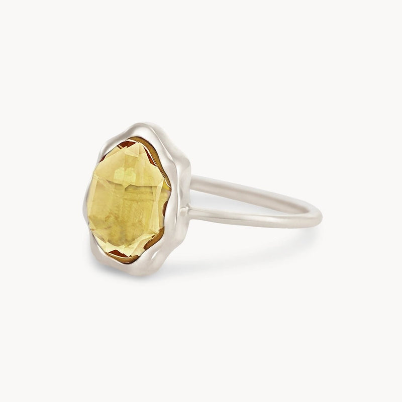 The "citrine mood ring silver" by bluboho features a faceted yellow citrine gemstone set in a pronged setting. The hexagonal-shaped gemstone is prominently displayed on a simple, polished sterling silver band and is photographed against a plain white background.