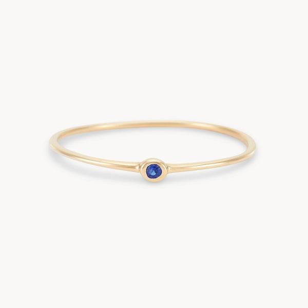 new bezel set serendipity blue sapphire  stacking ring - 10k yellow gold