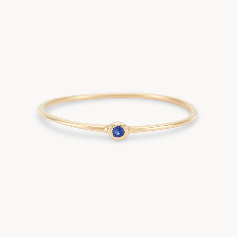 new bezel set serendipity blue sapphire  stacking ring - 10k yellow gold