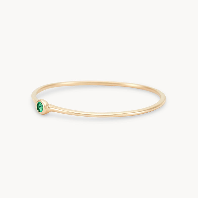 new bezel set serendipity emerald stacking ring - 10k yellow gold angled view