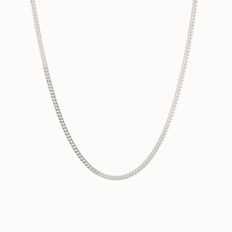 A delicate curb silver necklace made of sterling silver from bluboho, featuring a simple and classic design. The fine links create a smooth and elegant appearance, making it perfect for both casual and formal wear. Displayed against a plain white background, its silver-tone shines beautifully.