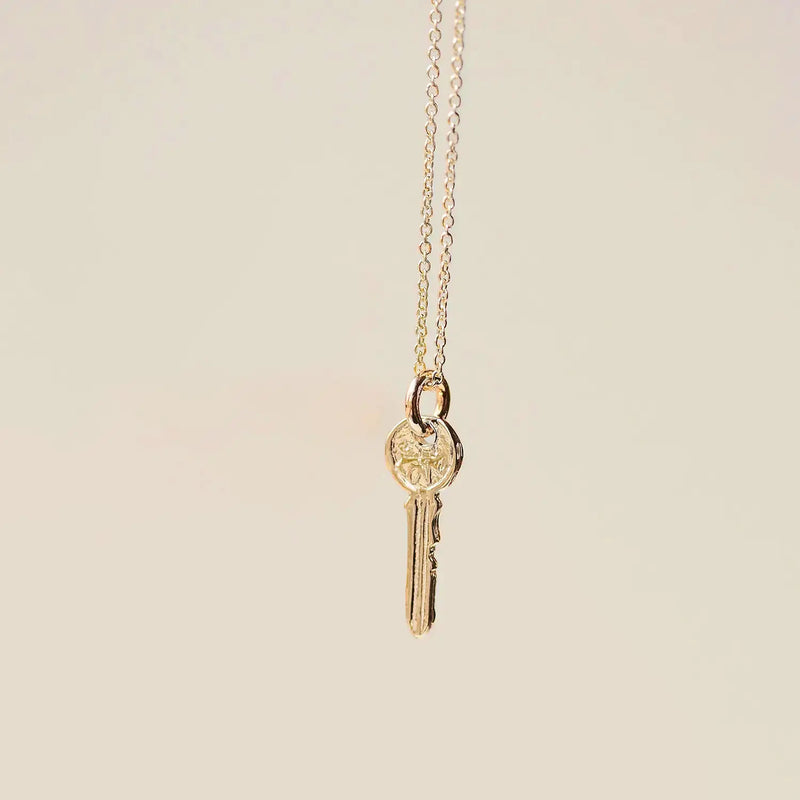 avata key charm - 10k yellow gold