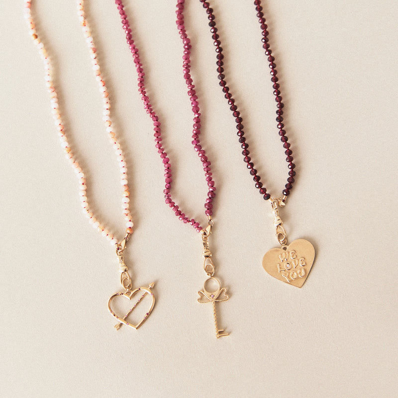 true aim heart & arrow charm - 10k yellow gold, ruby, pink sapphires