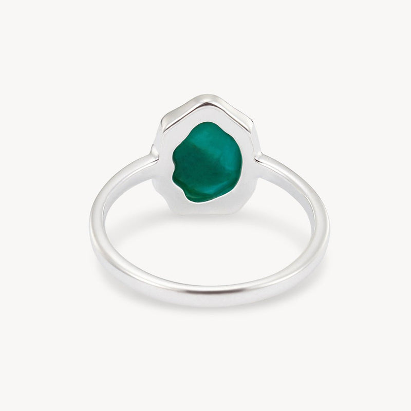 A turquoise mood ring silver - sterling silver, turquoise by bluboho featuring an irregularly shaped green stone setting. The stone is polished and has a glossy finish. The minimalist band emphasizes the unique, organic form of the green stone. The background is white, highlighting the ring's details.