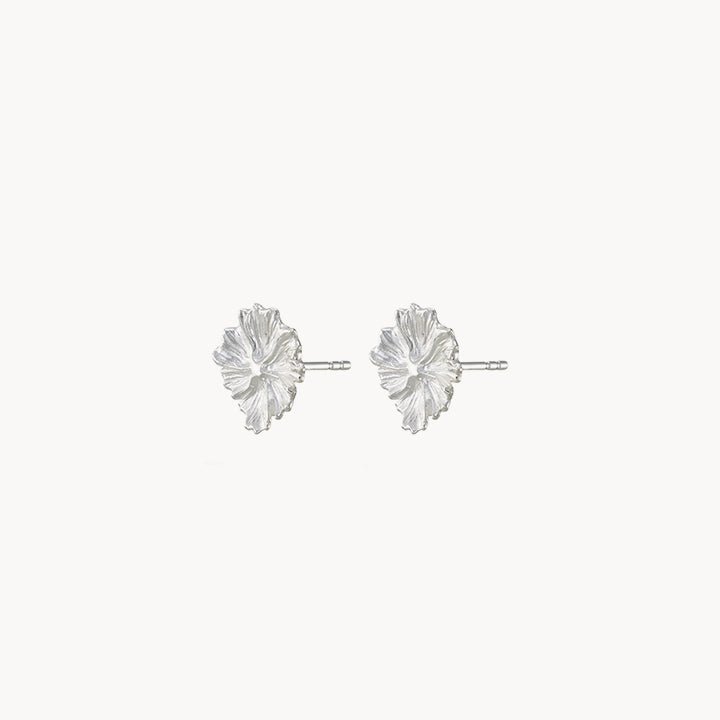 A pair of larger wildflower earrings in sterling silver by bluboho, photographed on a white background. Each earring showcases a meticulously detailed flower design with radiating petals. The intricate textures and glossy finish highlight the exquisite craftsmanship of this jewelry piece.