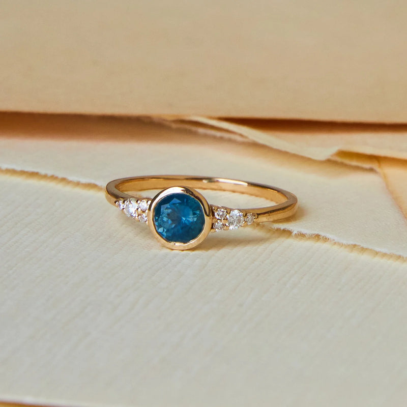 true blu one-of-a-kind engagement ring - 14k yellow gold, light royal blue round sapphire in person